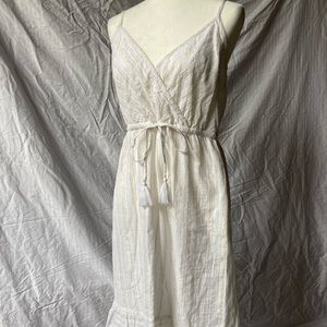 LOFT size 6 white midi dress with gold and silver thread detail.